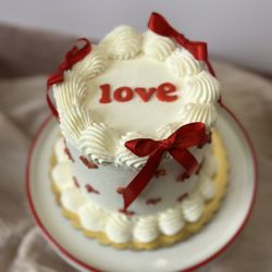 Sarah's Dessert Bar - Small four inch cake with hearts and bows on it for Valentine's Day or just to show some love!