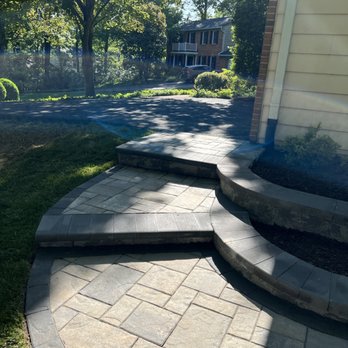 B.Hernandez Landscape - Two steps leading from the driveway to the side of the house. - Landscaping Near Me