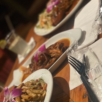Bellyful - plates of food on a wooden table - Bars Near Me - Brooklyn, New York Bellyful - plates of food on a wooden table - Bars Near Me - Brooklyn, New York