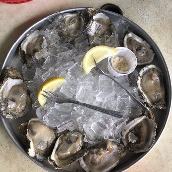 Our Deck Down Under - 10 raw oysters - not fully shucked (meat was still attached to the shell) - Seafood Near Me - Port Orange, Florida
