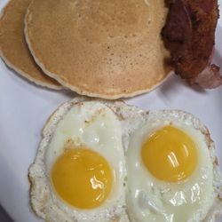 The Klamath Grill - Pancake breakfast with over easy eggs and bacon