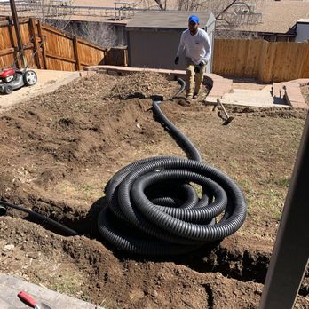 My LA Landscaping - a man with a hose in a yard - Landscaping Near Me - Brighton, Colorado My LA Landscaping - a man with a hose in a yard - Landscaping Near Me - Brighton, Colorado