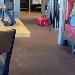 a woman sitting on a couch in a restaurant