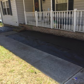 Brandon's Landscaping & Junk Removal - the front of a house with a tarp covering the front of the house - Landscaping Near Me Brandon's Landscaping & Junk Removal - the front of a house with a tarp covering the front of the house - Landscaping Near Me