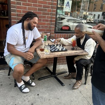 The Gallery BK - Playing chess with the owners - Caribbean Near Me - New York, New York
