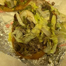 a sandwich with lettuce and meat a sandwich with lettuce and meat