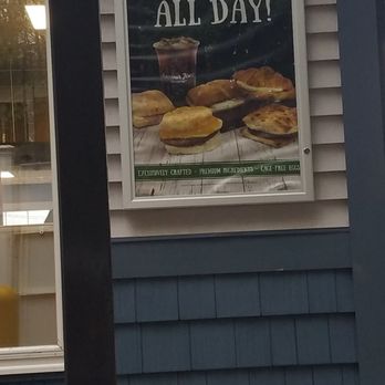 Aroma Joe's - a window with a sign that says enjoy all day - Coffee & Tea Near Me - West Ossipee, New Hampshire