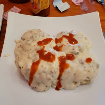 Delano's Diner - Sausage gravy and biscuit (full order). Hot sauce not included. Lol. Put hot sauce on before I remembered to take picture. - Coffee & Tea Near Me - Wichita, Kansas