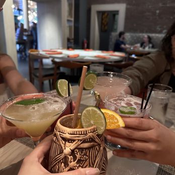TAKA - green leaf martini, the drink in the interesting cup is a umai tai, furthest drink that's a tad pink is a cosmo, and spicy Rosa Rita. - Japanese Near Me - Asbury Park, New Jersey