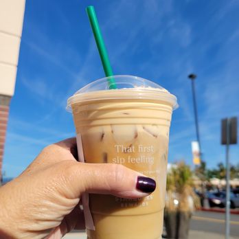 Starbucks - a hand holding a cup of iced coffee - Coffee & Tea Near Me - Troutdale, Oregon Starbucks - a hand holding a cup of iced coffee - Coffee & Tea Near Me - Troutdale, Oregon