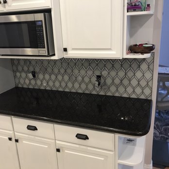 New Era Construction - Just about finished. These are the same cabinets sanded and repainted with new back splash, hardware, appliances & sink - General Contractors Near Me - Rancho Cucamonga, California