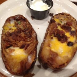 Fall Creek Steak and Catfish House - Two of the over cooked "free" potato skins we were served. The bacon was burnt as well.