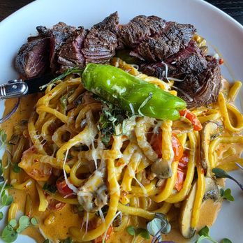 Roth SocialHouse - Spicy vodka pasta with added protein, hanger steak from different angle. - New American Near Me - Turlock, California