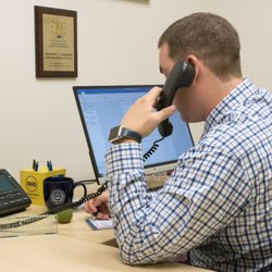 Law Offices of Maxwell Charles Livingston - Taking a call