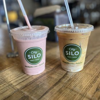 City Silo Table + Pantry - Jamin Smoothie w/ protein powder on the left Iced Latte w/Almond milk w/Vanilla extract on the right - Juice Bars & Smoothies Near Me - Memphis, Tennessee City Silo Table + Pantry - Jamin Smoothie w/ protein powder on the left Iced Latte w/Almond milk w/Vanilla extract on the right - Juice Bars & Smoothies Near Me - Memphis, Tennessee