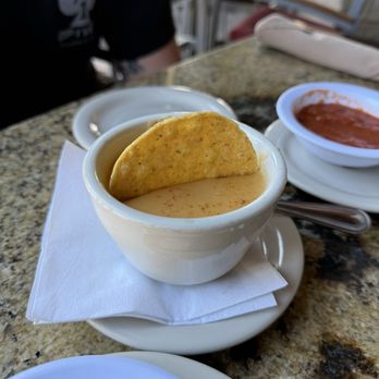 Anamia's Tex Mex - Cup of yellow queso which - Mexican Near Me - Flower Mound, Texas