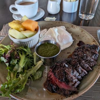 Rye Leawood - Steak and eggs with mixed greens, pesto sauce and fruit - New American Near Me - Leawood, Kansas