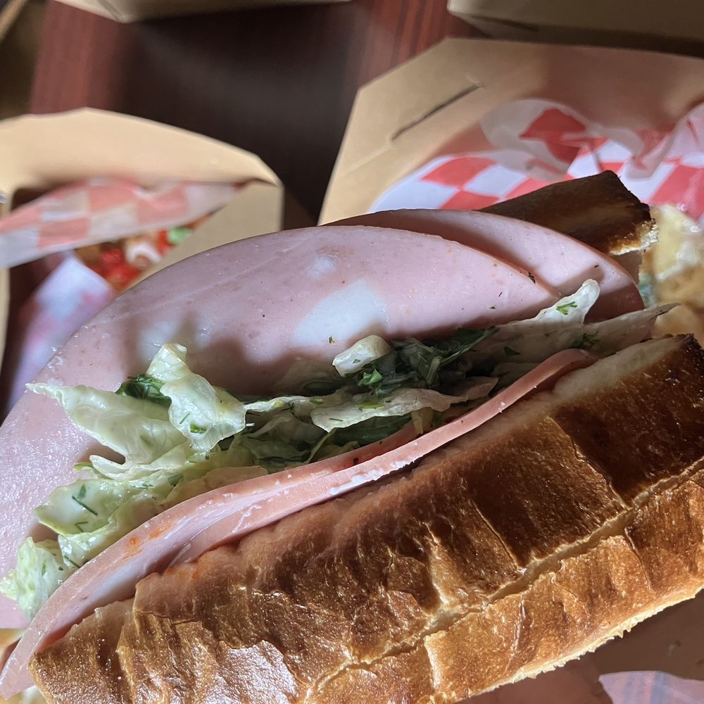 Valentino's Pizza - 1/2 Spicy Mortadella sub. Burn from the peppers is not immediate, and a lovely slaw balances the sandwich 26APR26 - Pizza Near Me - San Marcos, Texas