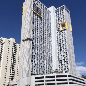 Ke Kilohana - Outside of the building. Photo from across the street, in the Ohana Marketplace parking lot. - Condominiums Near Me - Honolulu, Hawaii