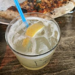 Brick oven pizza and the Queen Bee cocktail. Brick oven pizza and the Queen Bee cocktail.