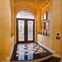 Seth Koppel - TexHomes Realty - I love these Canterra Iron Doors and flooring inlaid with Black Galaxy Granite!