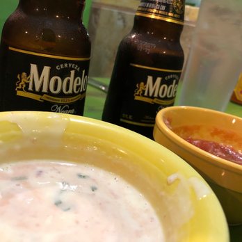 El Vaquero - a bowl of soup and two bottles of beer - Mexican Near Me - Mattoon, Illinois