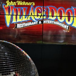 The Village Door - Largest mirrorball I've ever seen in front of a massive TV complex for entertainment