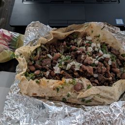 Asada burrito (accidentally unfolded) with rice, beans, cilantro and onions Asada burrito (accidentally unfolded) with rice, beans, cilantro and onions