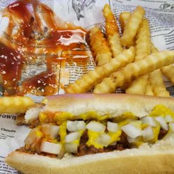 Hot dog w chili, mustard and onions. I don't think they're famous, but they're made in the spot and are piping hot when served