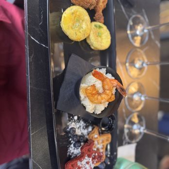 Pur Noire Urban Wineries - Left to right: chicken wings, egg bites, shrimp and grits, waffles - Wine Tasting Room Near Me - Houston, Texas Pur Noire Urban Wineries - Left to right: chicken wings, egg bites, shrimp and grits, waffles - Wine Tasting Room Near Me - Houston, Texas
