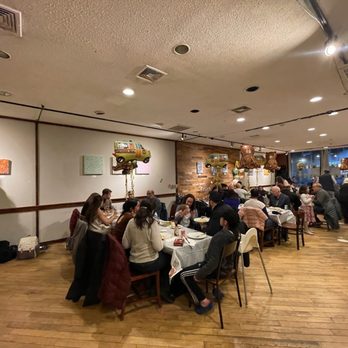 Batavia Cafe - a large group of people sitting at tables - Cafes Near Me - Summit, New Jersey