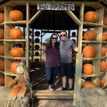 P-6 Farms - two people standing in a pumpkin stand - Farmers Market Near Me - Montgomery, Texas P-6 Farms - two people standing in a pumpkin stand - Farmers Market Near Me - Montgomery, Texas