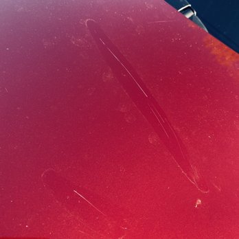 AB Auto Glass - Scratches left where I'm guessing he rested the glass on the hood instead of laying down some kind of protective barrier. - Auto Glass Services Near Me