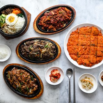 Korea Restaurant - a variety of dishes on a table - Korean Near Me - Minneapolis, Minnesota Korea Restaurant - a variety of dishes on a table - Korean Near Me - Minneapolis, Minnesota