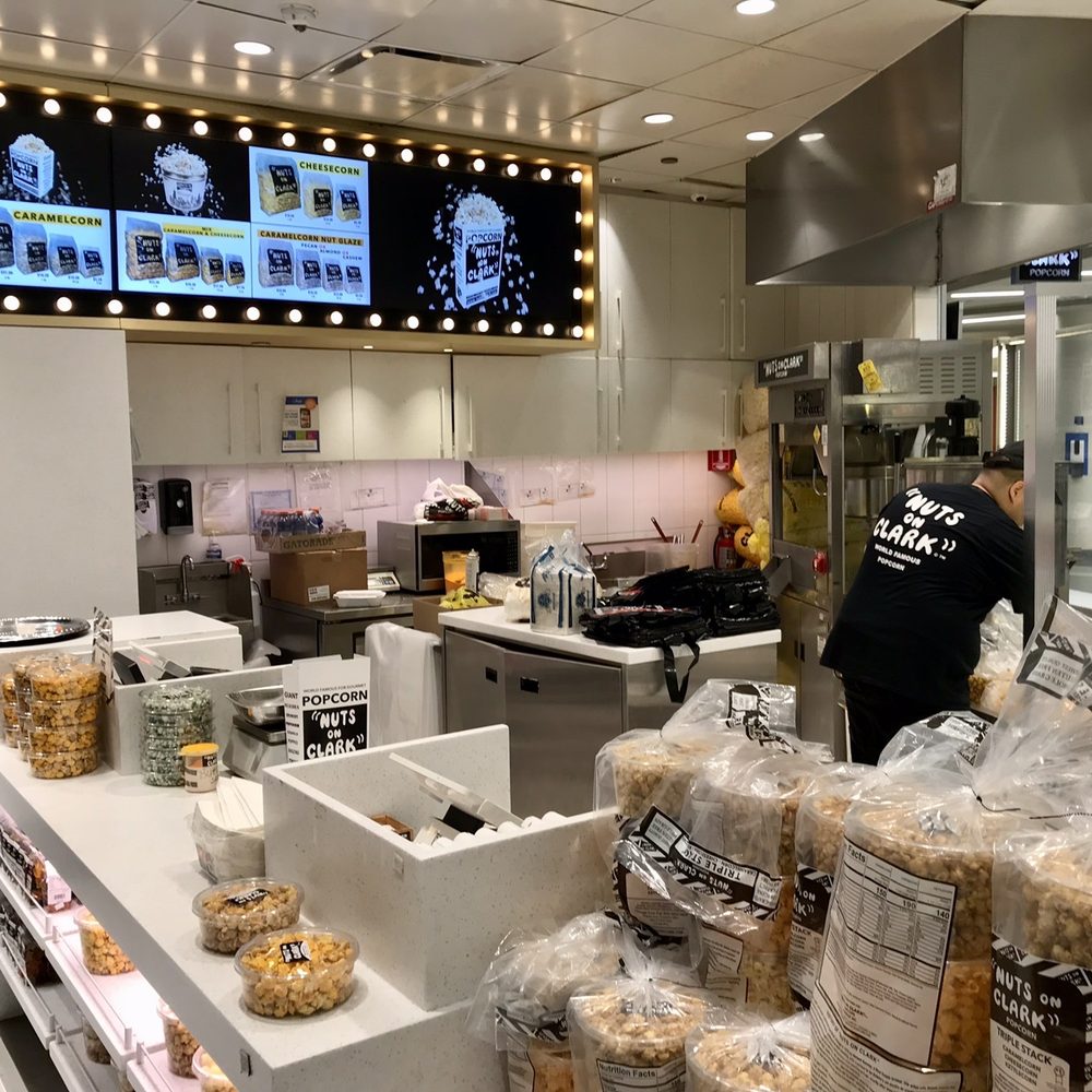 Nuts On Clark - a man working in a commercial kitchen - Popcorn Shops Near Me - Chicago, Illinois Nuts On Clark - a man working in a commercial kitchen - Popcorn Shops Near Me - Chicago, Illinois