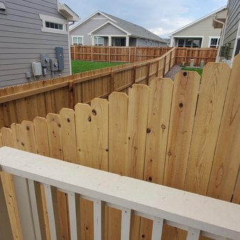 Colorado Construct All - Mother-in-law side. Fence was installed above a retaining wall with a scale rather than sharp 90 degree angles. - General Contractors Near Me