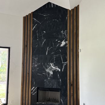 Renovte - a fireplace in the middle of a living room - Painters Near Me Renovte - a fireplace in the middle of a living room - Painters Near Me
