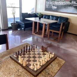 a chess board and chairs a chess board and chairs