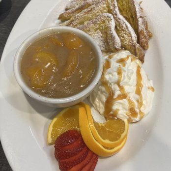 Flavor Table - The awesome peach cobbler French toast with whipped cream strawberries and orange slices. Its sooooo guuud!!!! - Cajun/Creole Near Me - Los Angeles, California