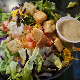 House salad with yummy feta vinaigrette dressing. House salad with yummy feta vinaigrette dressing.