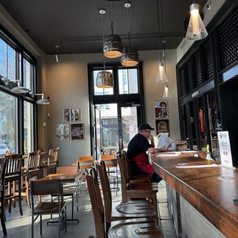 Great Notion - Berkeley - a woman sitting at a bar - Brewpubs Near Me - Berkeley, California