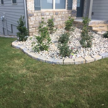 RHM Landscaping - the front of a house with a rock garden - Landscaping Near Me RHM Landscaping - the front of a house with a rock garden - Landscaping Near Me