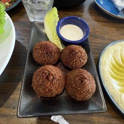 Baba ghanouj, stuffed falafel, hummus avocado, mixed grill platter and shush tawook.