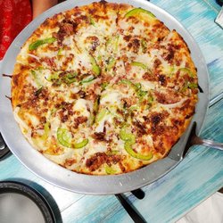 Circle Pizza - Our pizza,  bacon, onion with green  peppers.