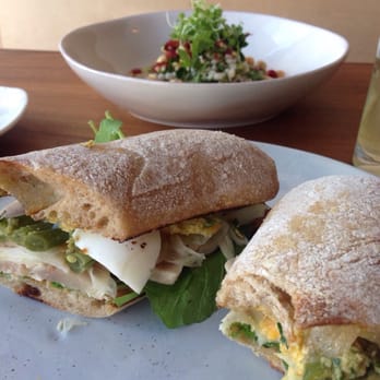 Part and Parcel - Tuna sandwich with the warm hummus and barley salad in the background. - Canadian (New) Near Me - Victoria, British Columbia