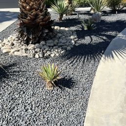 They cleaned out the old dirty rocks, trimmed the plants and put down new weed barrier and put down the new rocks. They cleaned out the old dirty rocks, trimmed the plants and put down new weed barrier and put down the new rocks.