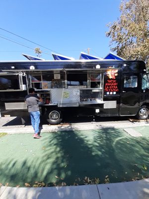 Photo of Tortas Ahogadas La Guera - Santa Ana, CA, US. a man standing in front of a food truck