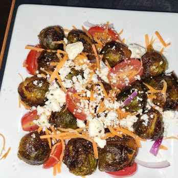 Cask & Cow - a plate of brussel sprouts and tomatoes - American Near Me - Lewiston, New York Cask & Cow - a plate of brussel sprouts and tomatoes - American Near Me - Lewiston, New York