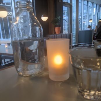 Leopard - a candle and a glass of water on a table - Pizza Near Me - Edmonton, Alberta Leopard - a candle and a glass of water on a table - Pizza Near Me - Edmonton, Alberta