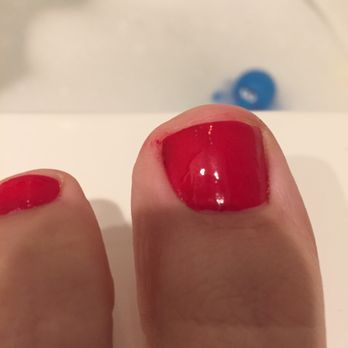 Kerry Nail Spa - Old polish underneath new polish. - Nail Salons Near Me - Nanuet, New York